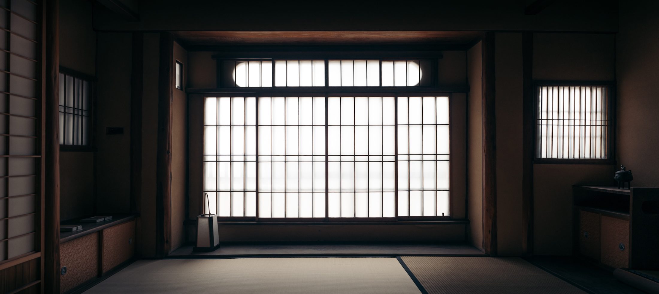 A tatami room lit through a wide shoji window