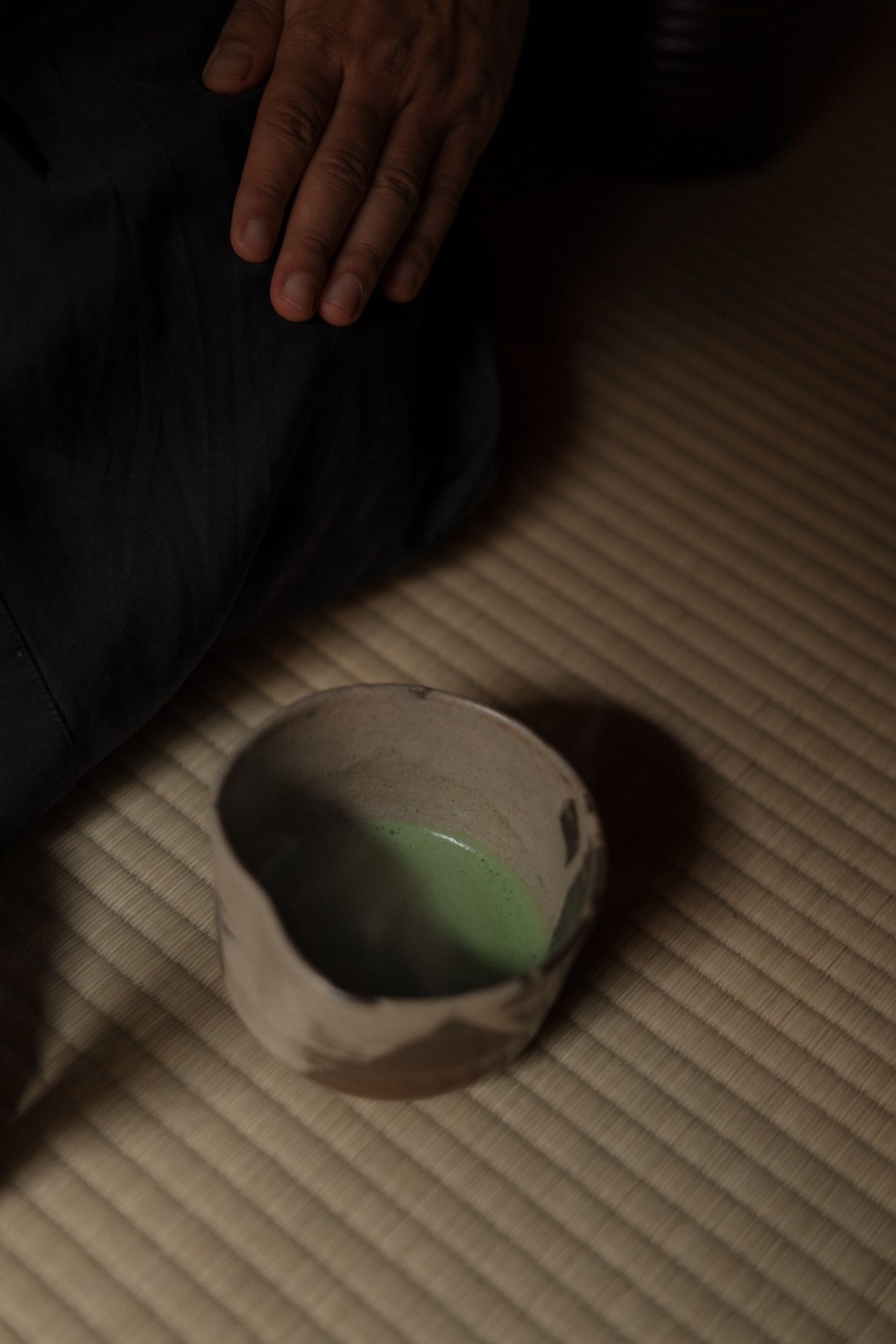 A bowl of matcha on the tatami in the dark